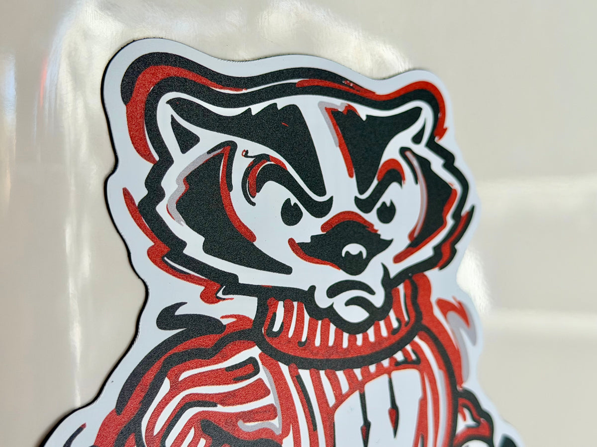 Badger character magnet head with black, white, and red striped details