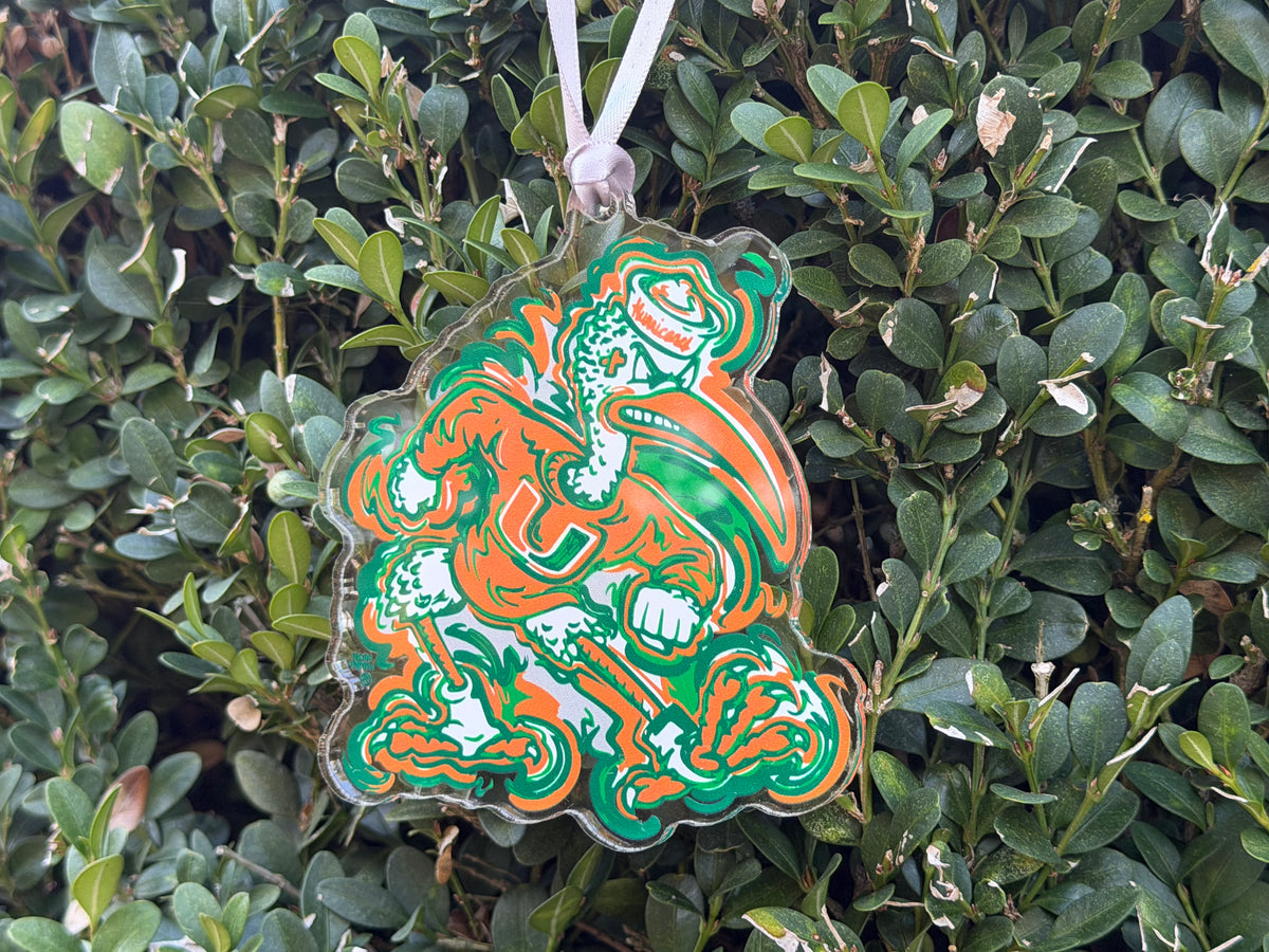 Hanging mascot ornament with orange-and-green roaring figure and top loop string