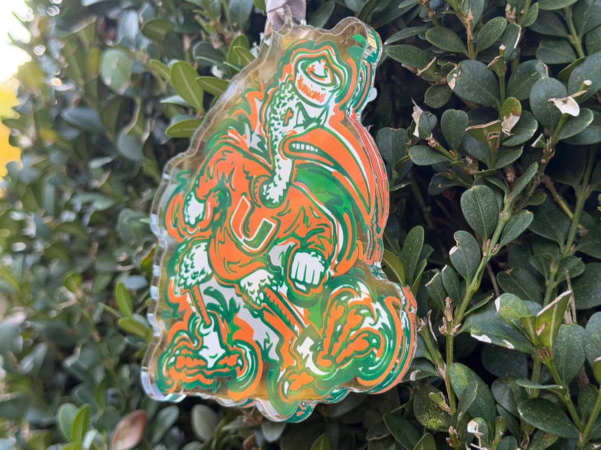 Hanging orange-and-green mascot ornament with detailed roaring design and hanging string loop