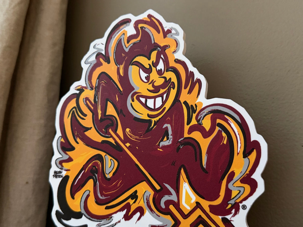 Sun Devil mascot standee close-up head with maroon, gold, and flame details