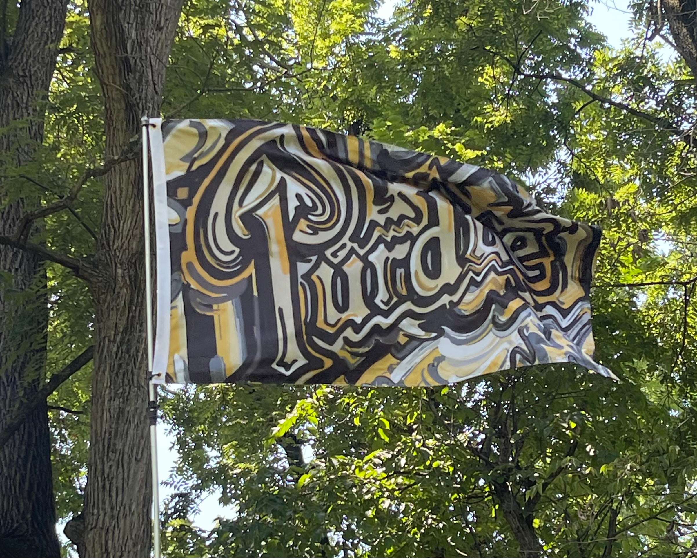 Purdue University Purdue Drum Flagpole Flag 5' x 3" by Justin Patten (2 grommets)