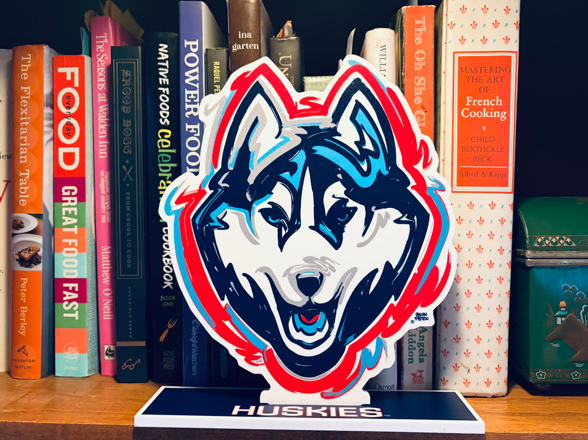 University of Connecticut mascot standee with Huskies logo on tabletop base