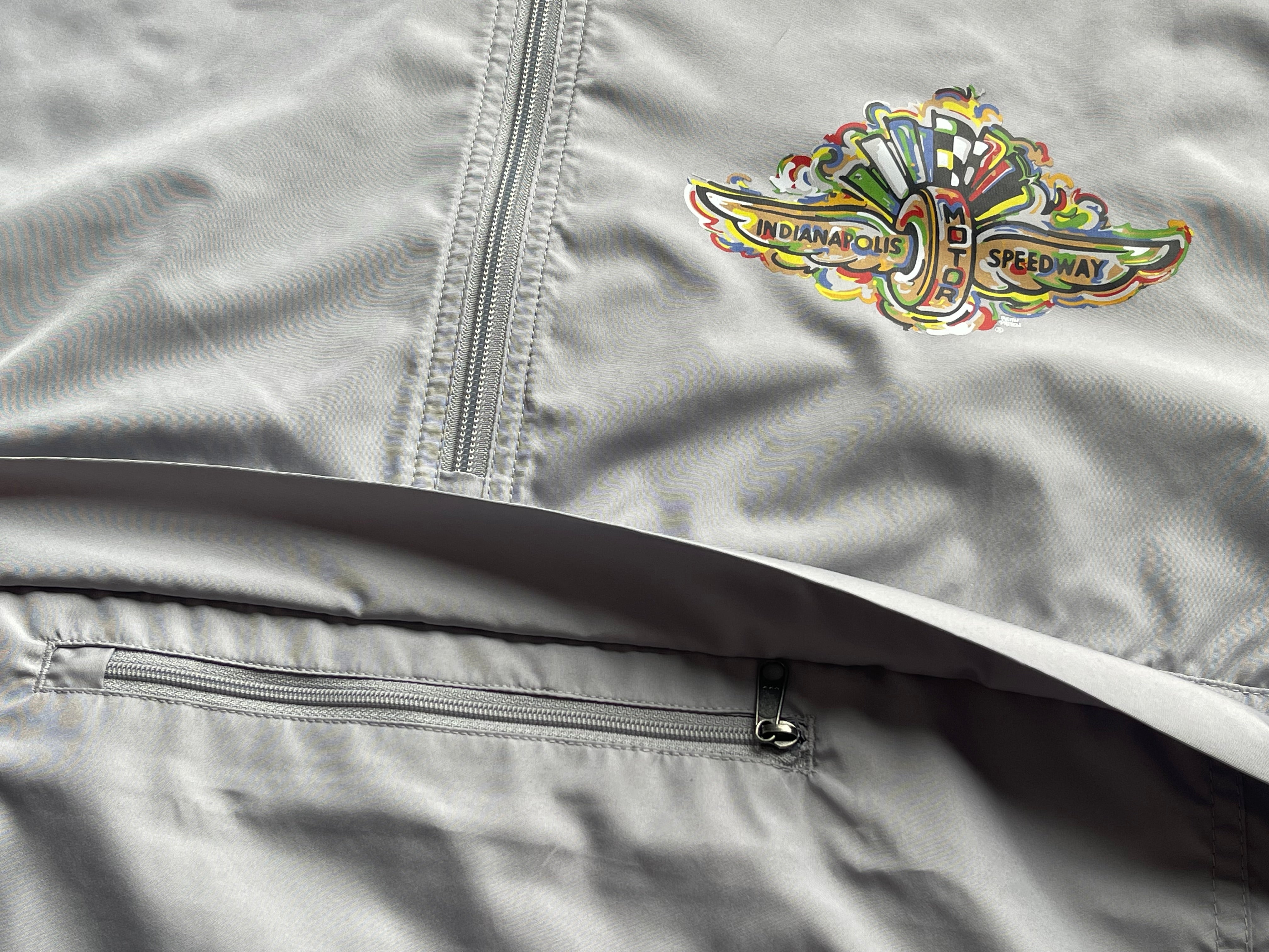 Indianapolis Motor Speedway Wing and Wheel Quarter Zip Packable Windbreaker by Justin Patten (Light Grey)