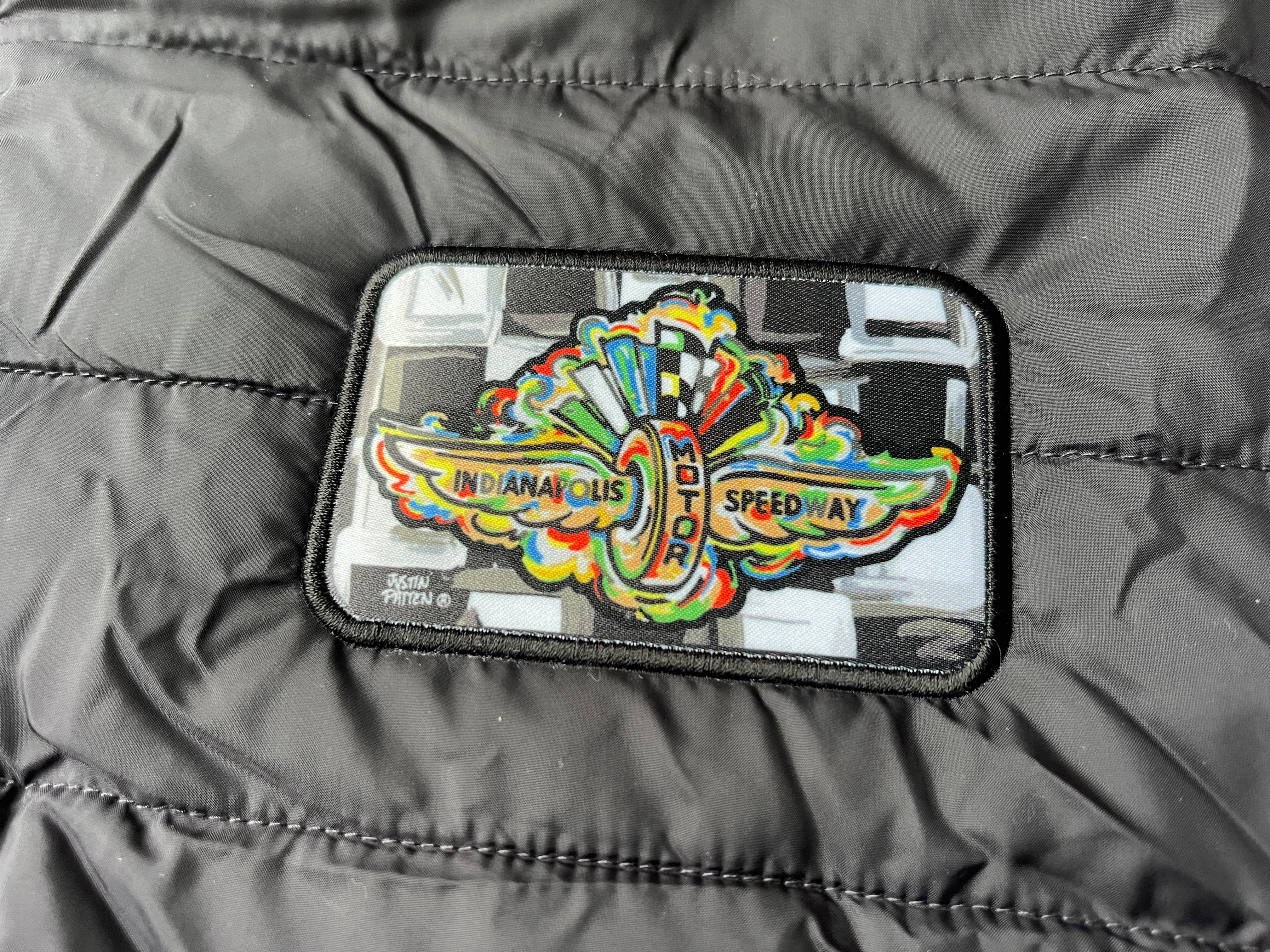 Indianapolis Motor Speedway Wing and Wheel Zip Up Packable Jacket by Justin Patten (Black)