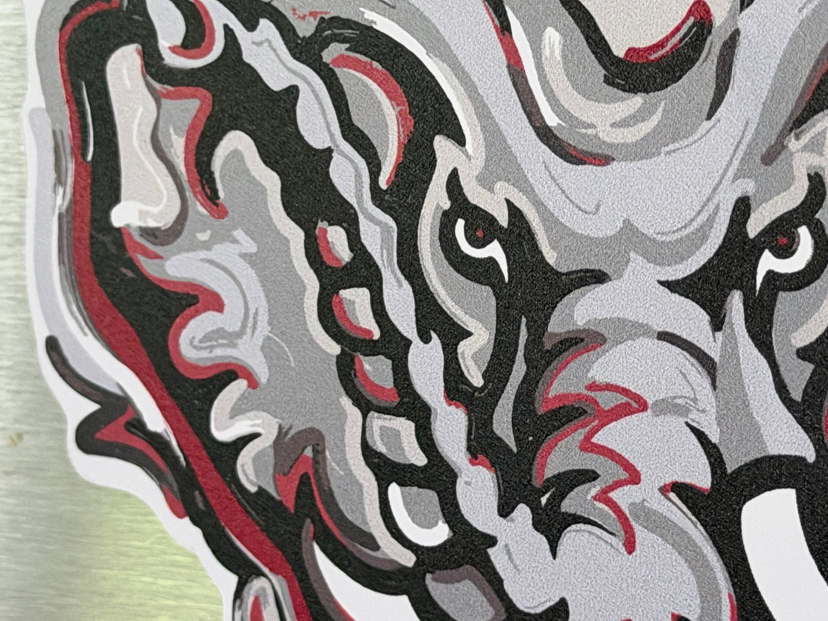Close-up of the magnet's Big AL artwork, showing detailed crimson, black and gray lines.