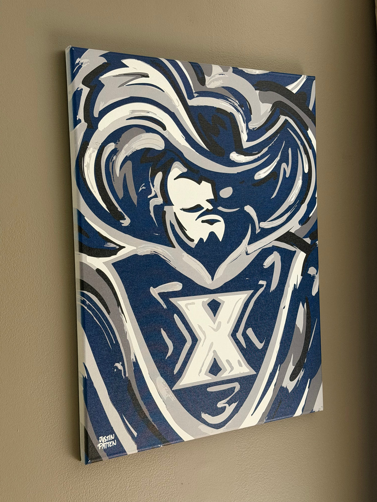 16x20 wrapped canvas print showing blue-and-white lion mascot with X emblem