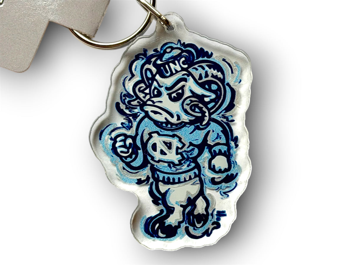 University of North Carolina mascot keychain with a blue and white cartoon ram design.