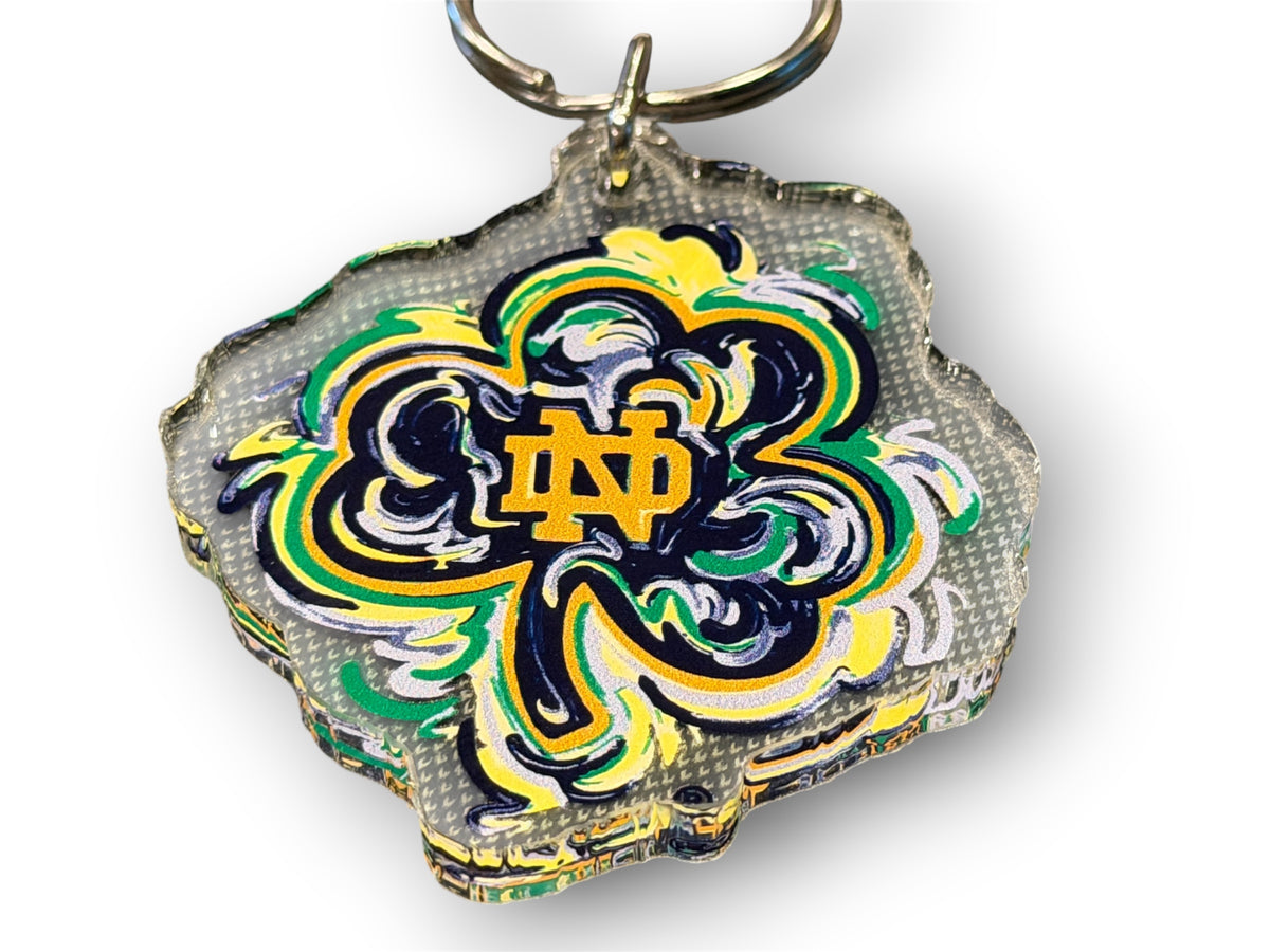 Notre Dame clover keychain with ND crest in yellow, blue, and green and keyring