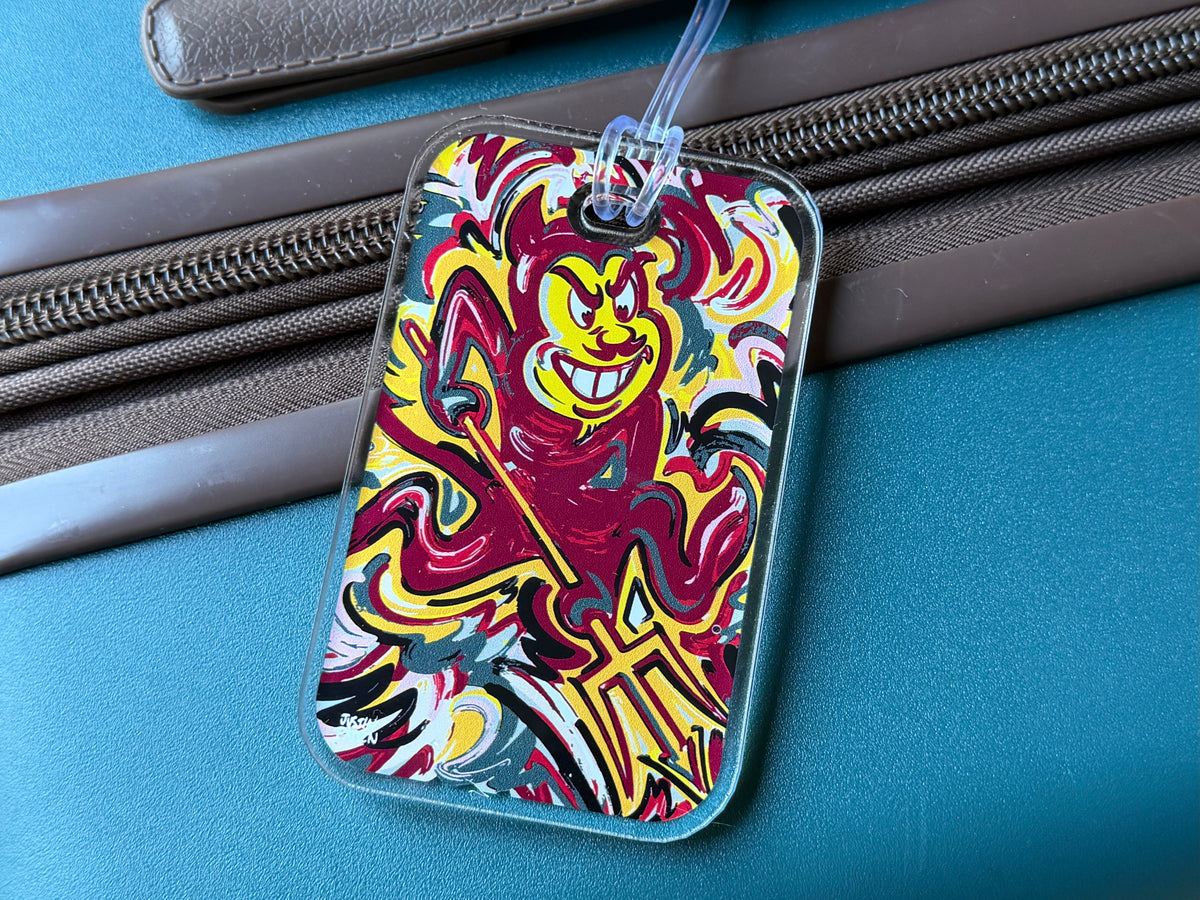 Mascot bag tag showing devil mascot artwork on blue background with hanging string