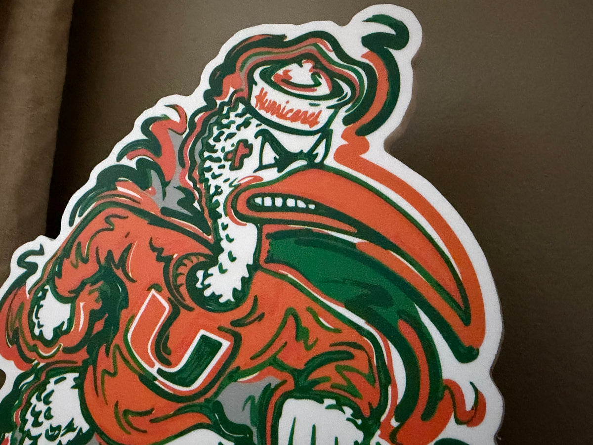Miami Hurricanes mascot standee close-up, orange and green eagle head with beak