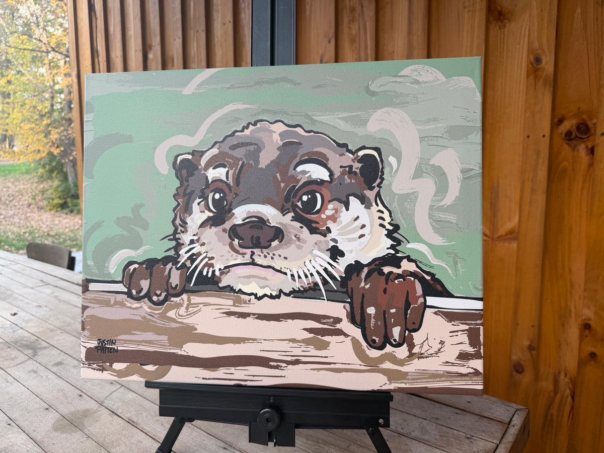 Otter canvas print displayed at an angle, showing its paws on a ledge