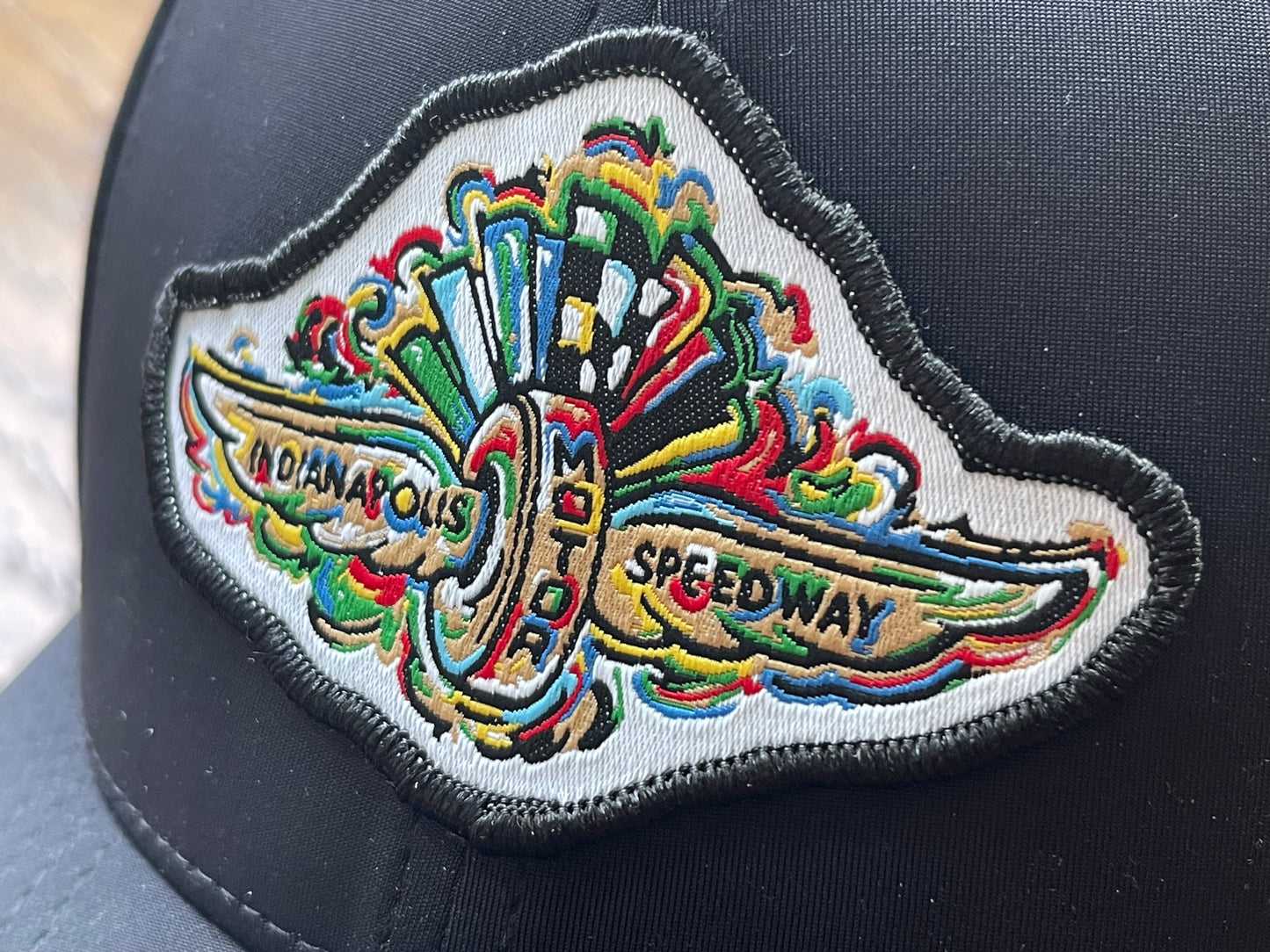 Indianapolis Motor Speedway Black Wing and Wheel Hat by Justin Patten