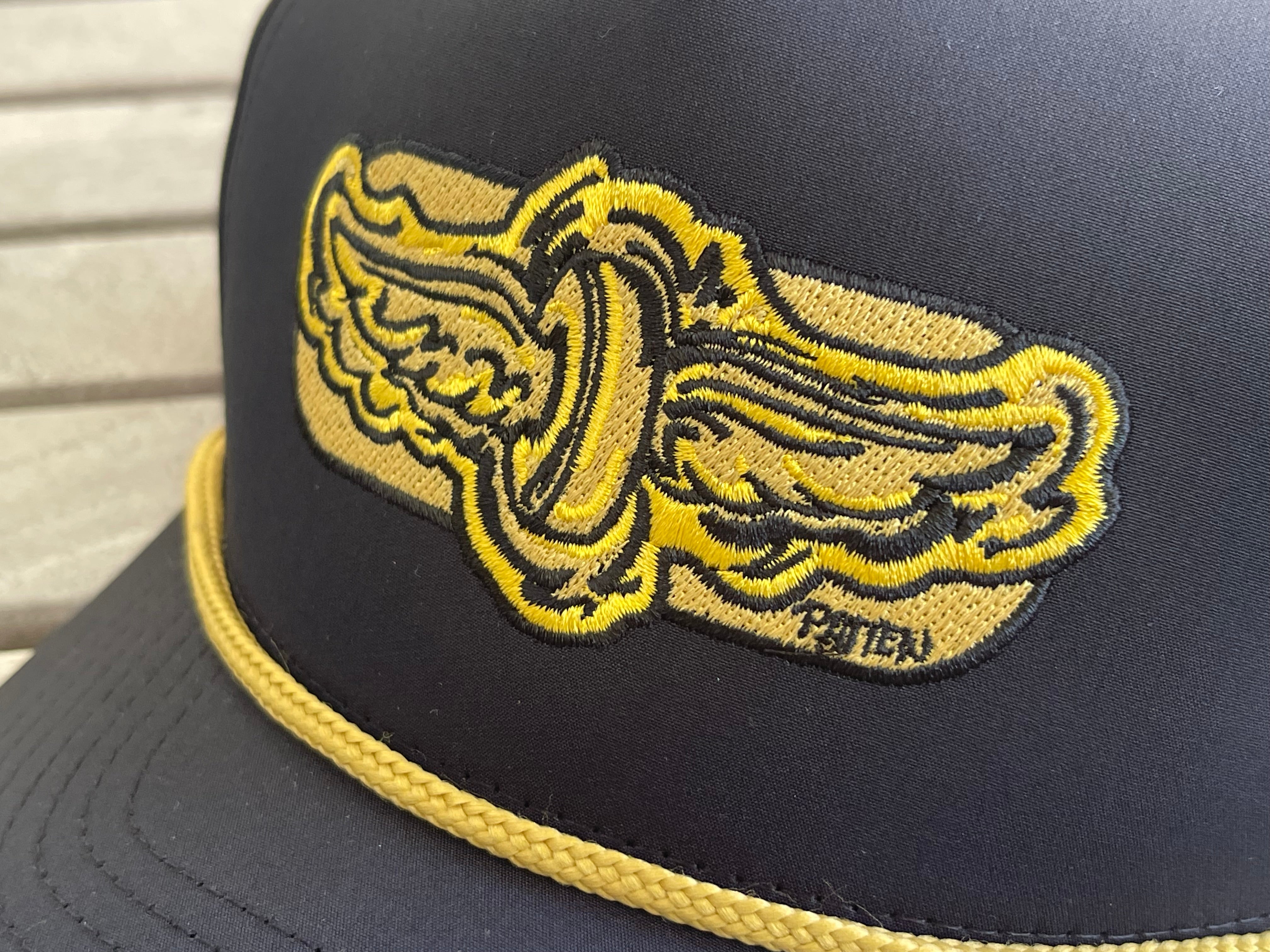 Indianapolis Motor Speedway Gold Wing and Wheel Hat with Gold Rope by Justin Patten (Black with Rope)