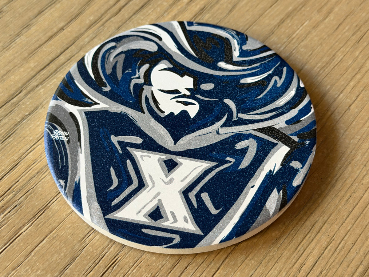 Round coaster with blue and white mascot graphic and large white X emblem
