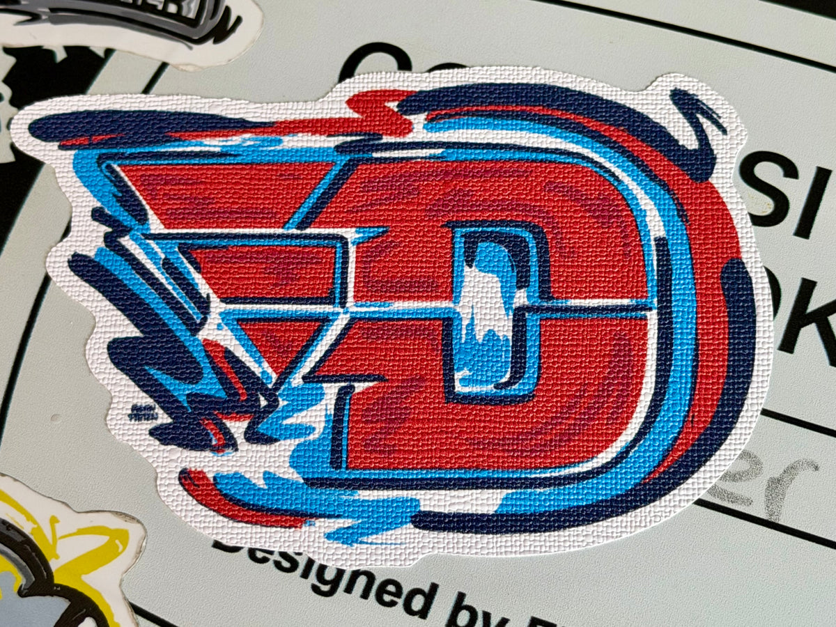 University Flying D logo sticker, red and blue D with wings and outline