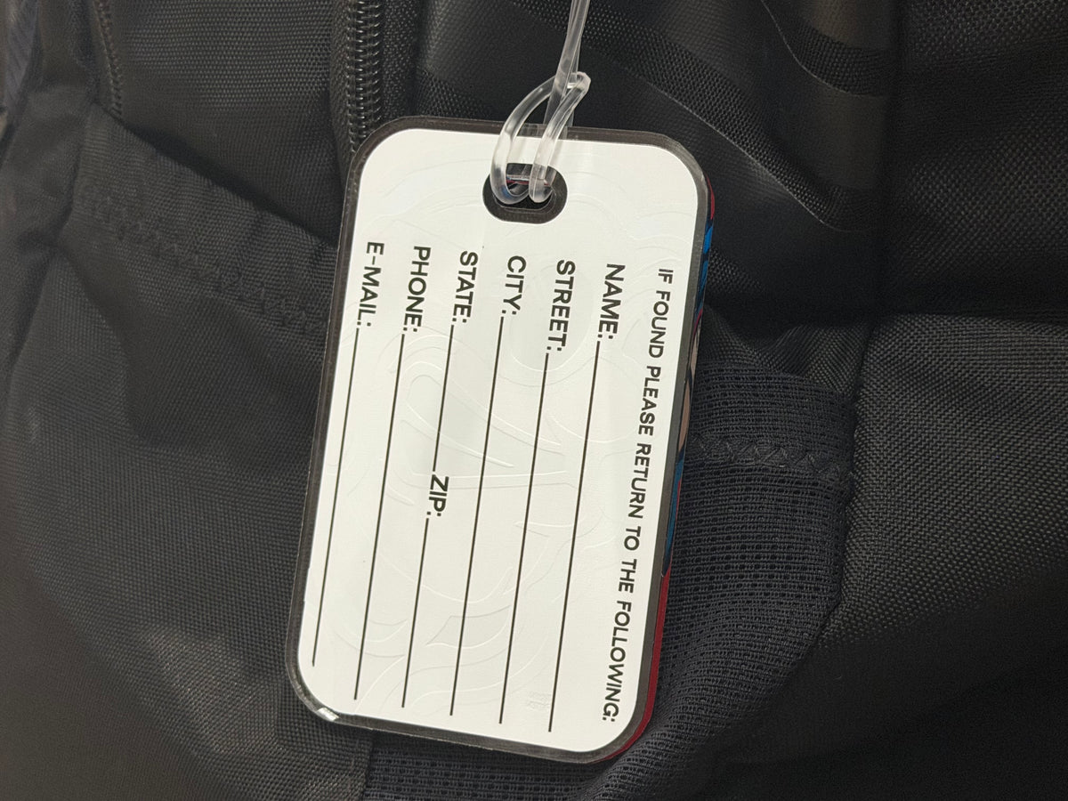 Back of bag tag insert with printed contact fields and lines, clear plastic frame