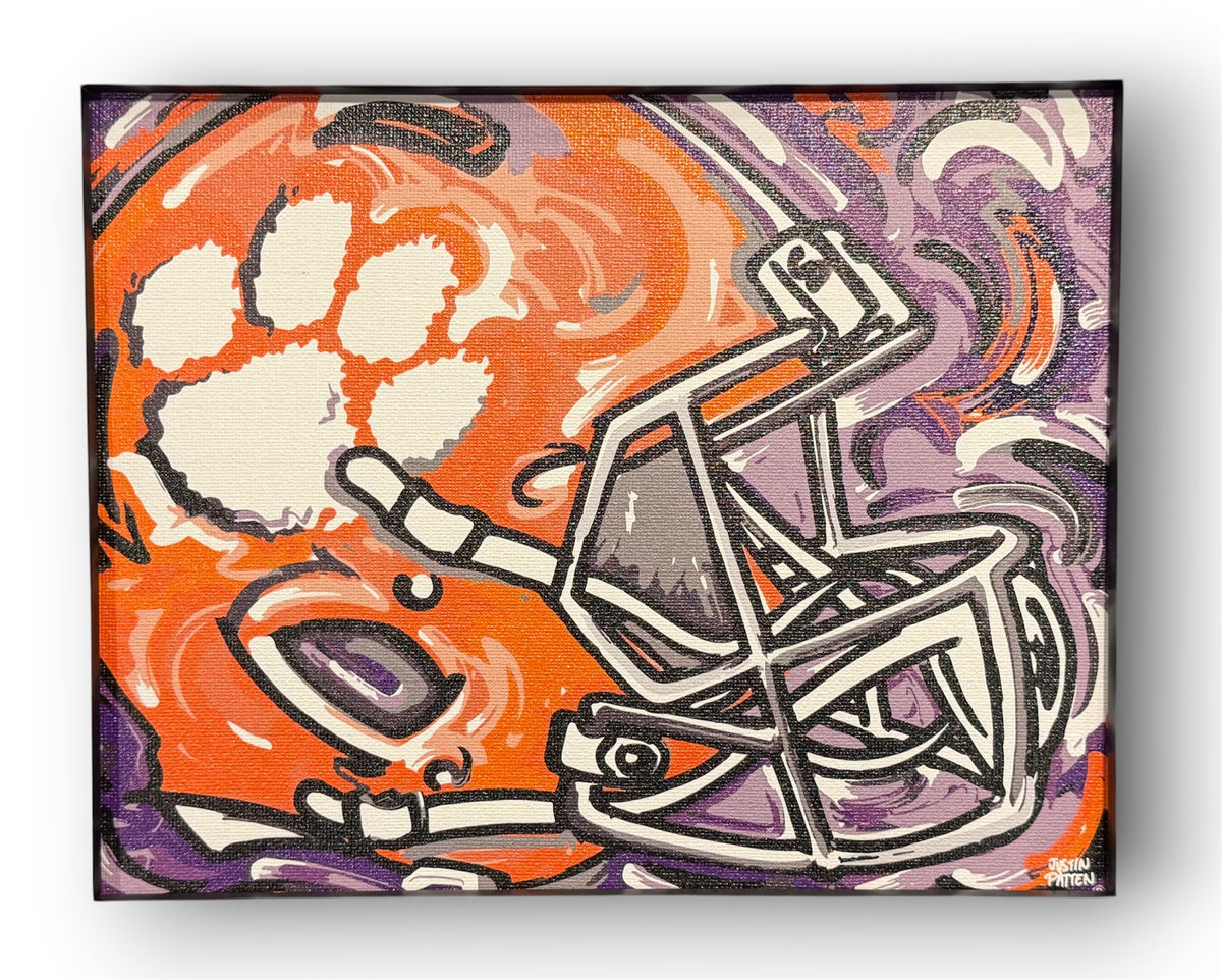Rolled canvas football helmet wall art with orange and purple tiger head graphic