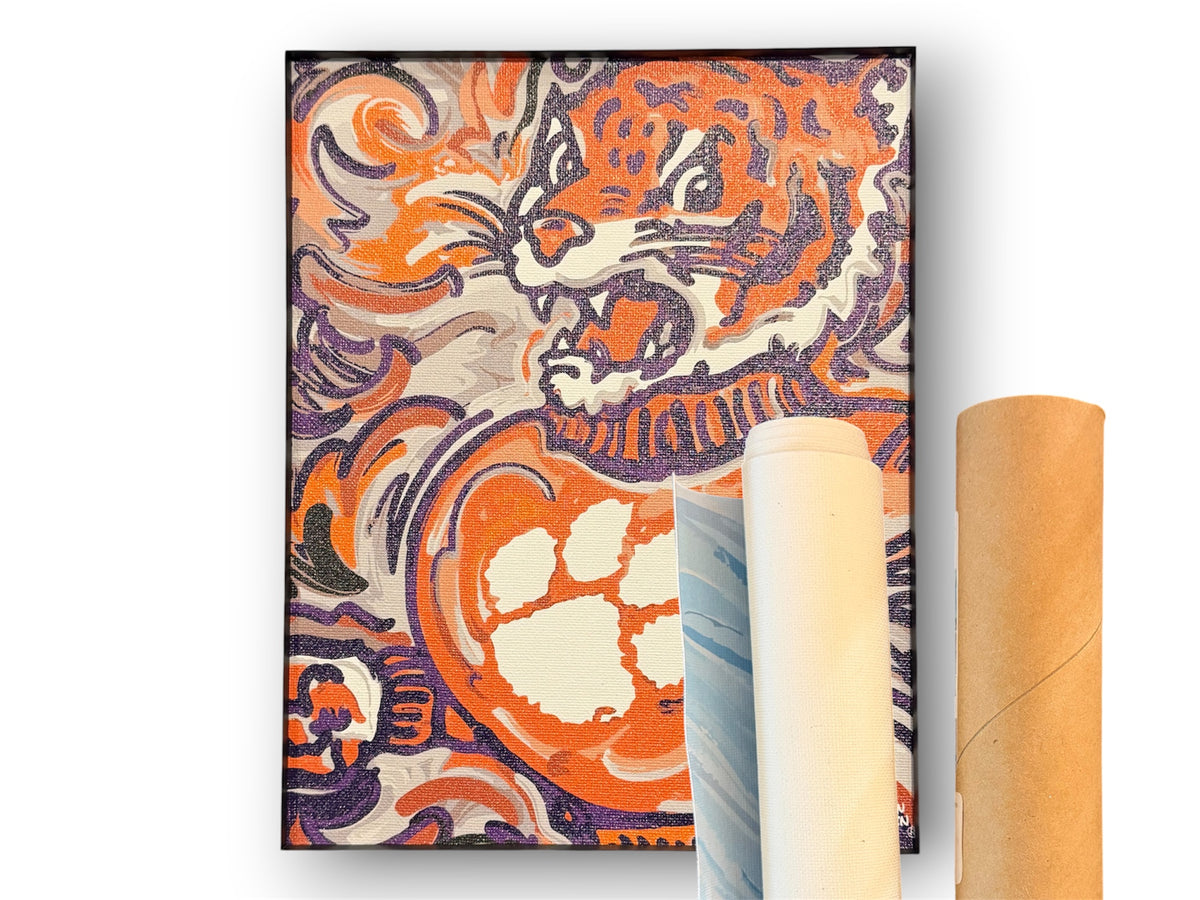 Tiger mascot canvas print in black border; rolled canvas shows artwork beside it