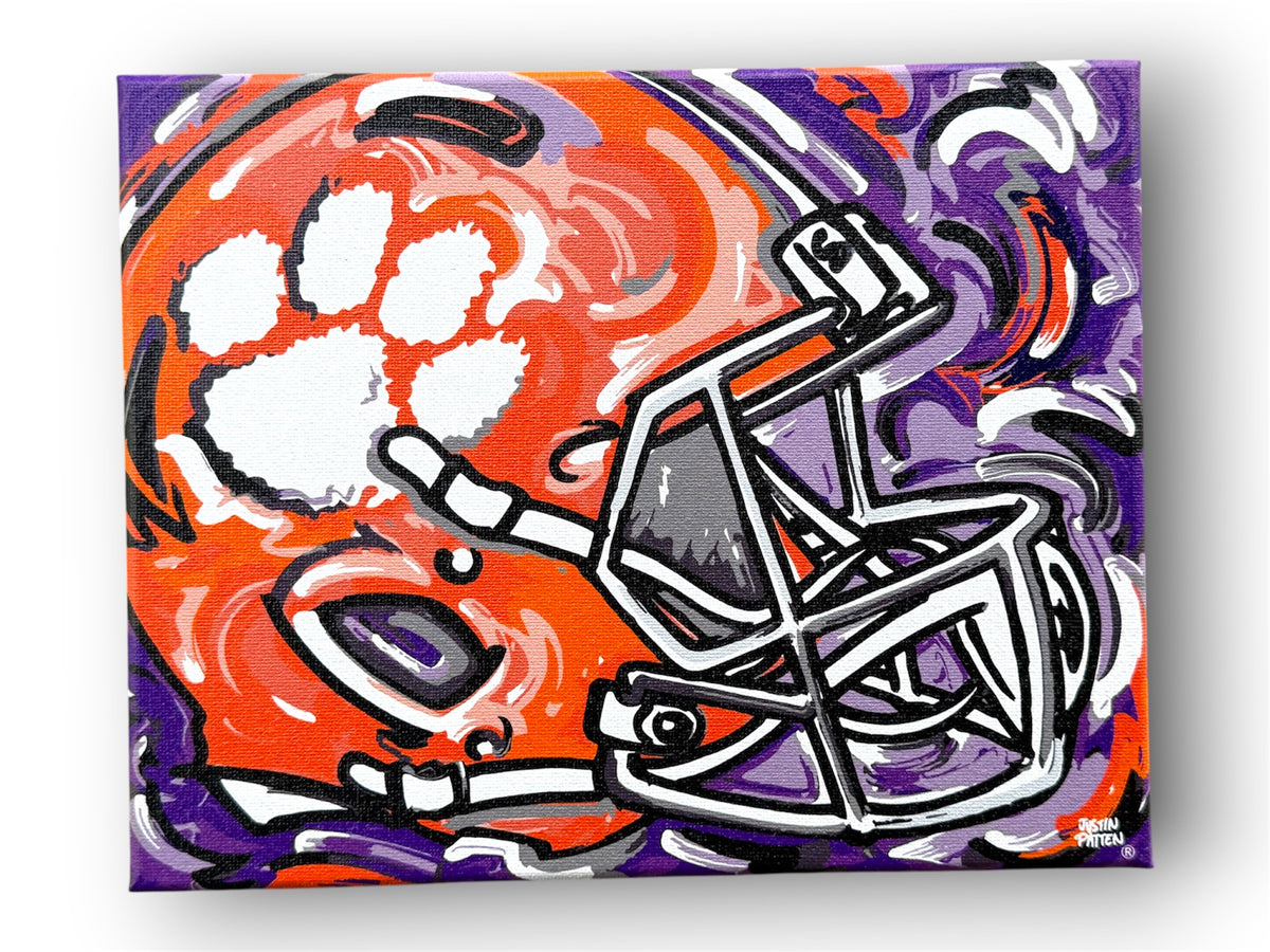 Clemson University wrapped canvas print with an orange football helmet, white paw print, and purple accents